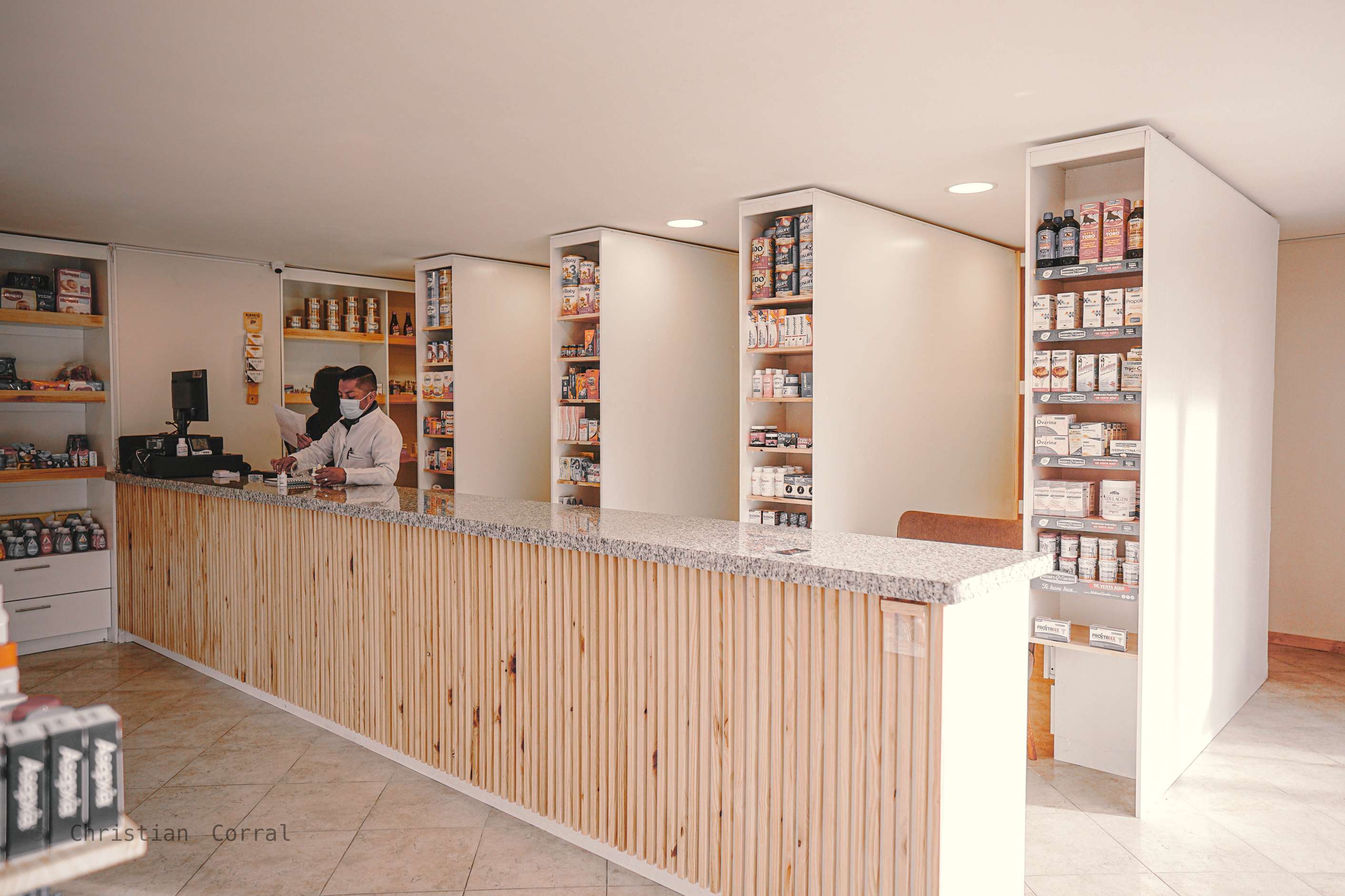 Evening view showing illuminated storefront